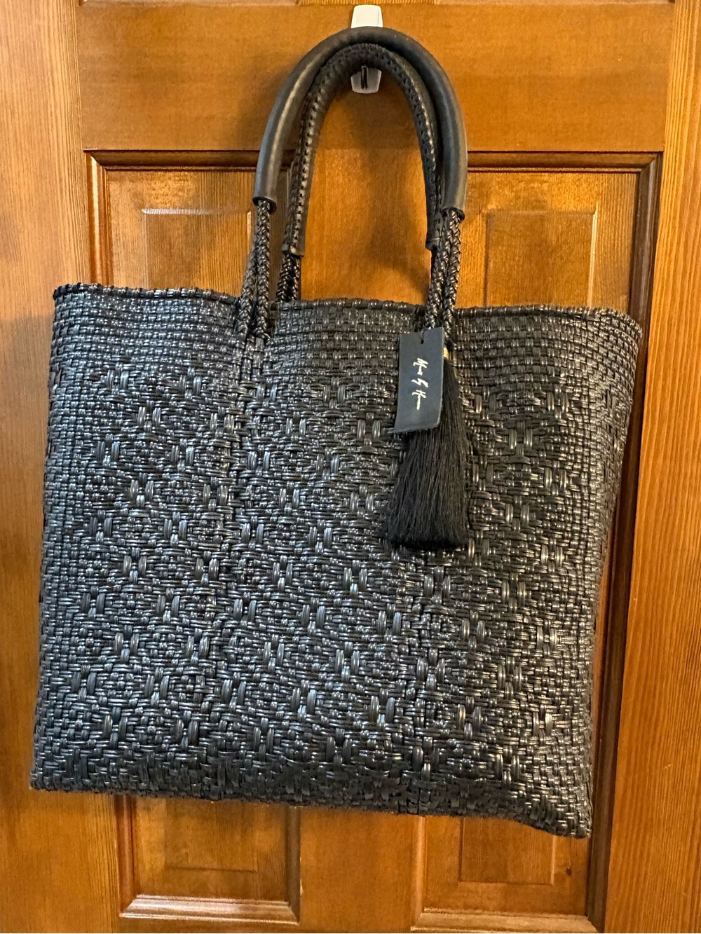 Woven Black Tote with Decorative Tassel
